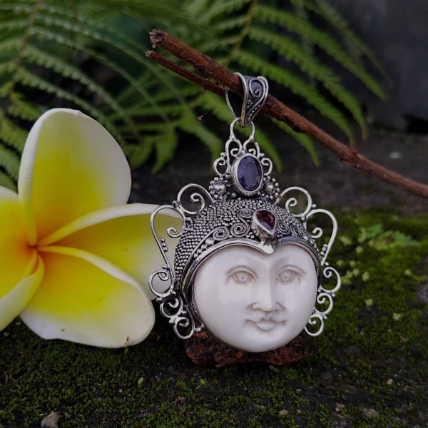handmade goddess bone face in solid silver pendant. with gems code 012