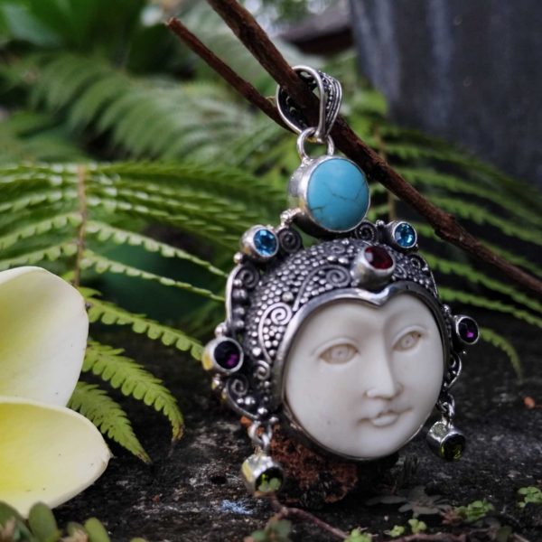 handmade goddess bone face in solid silver pendant. with gems code 011