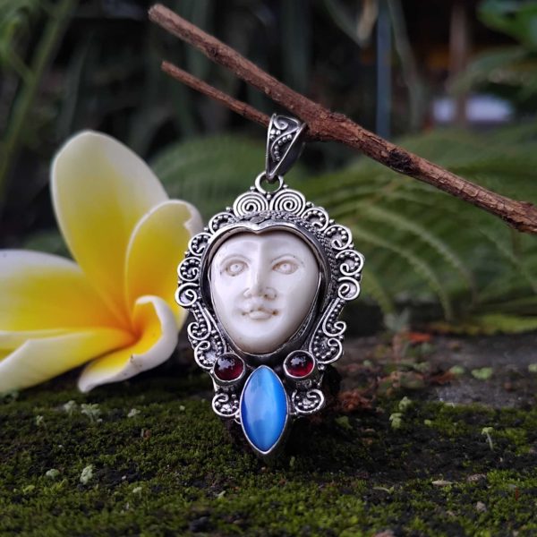 handmade goddess bone face in solid silver pendant. with gems code 010