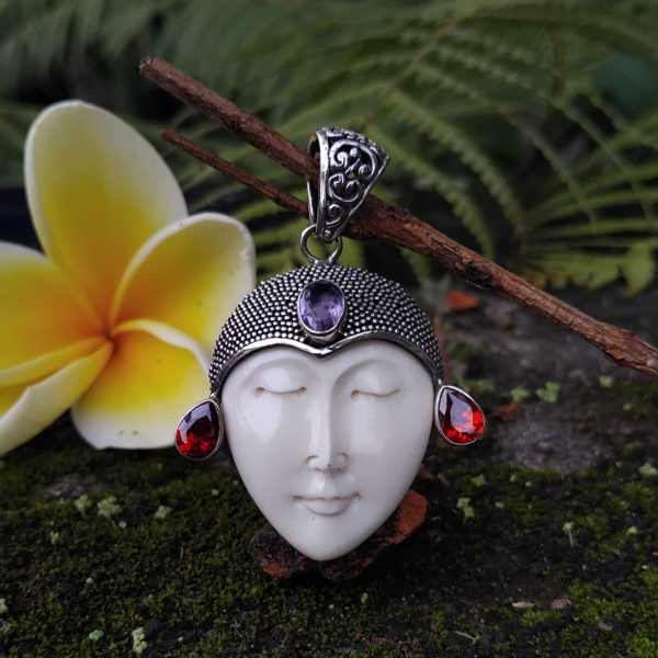 handmade goddess bone face in solid silver pendant. with gems code 86